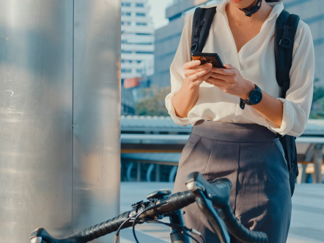 woman-use-smart-phone-look-camera-in-city