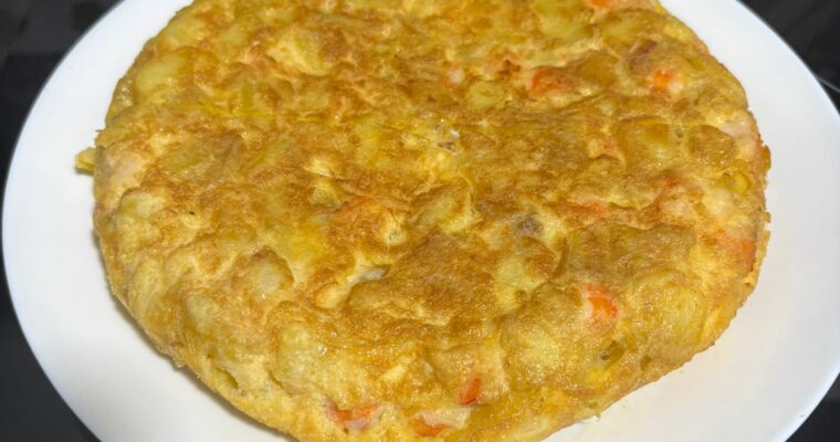 Tortilla de Patatas con Langostinos.